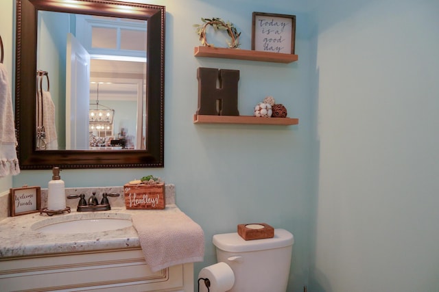 bathroom with toilet and vanity