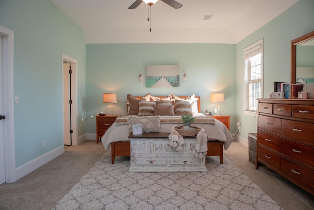 carpeted bedroom with ceiling fan and lofted ceiling