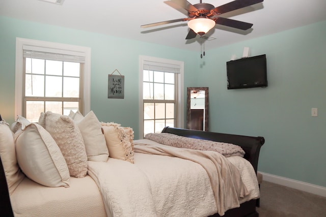 carpeted bedroom with ceiling fan