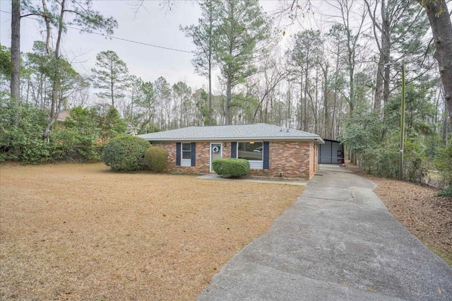 single story home featuring a carport