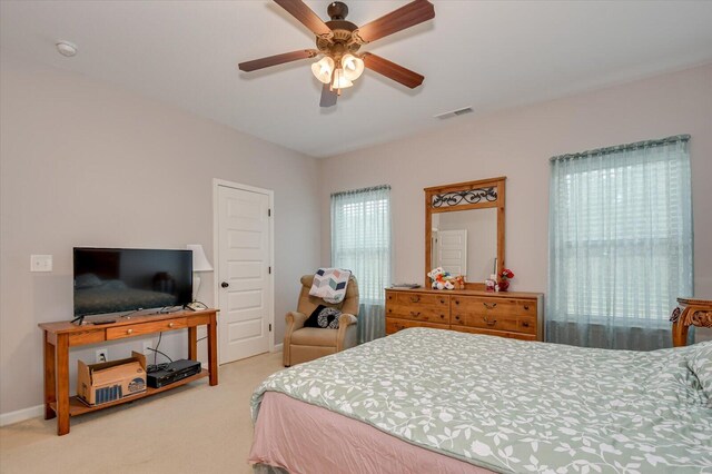 carpeted bedroom featuring ceiling fan