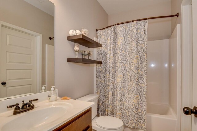 full bathroom featuring vanity, toilet, and shower / bathtub combination with curtain