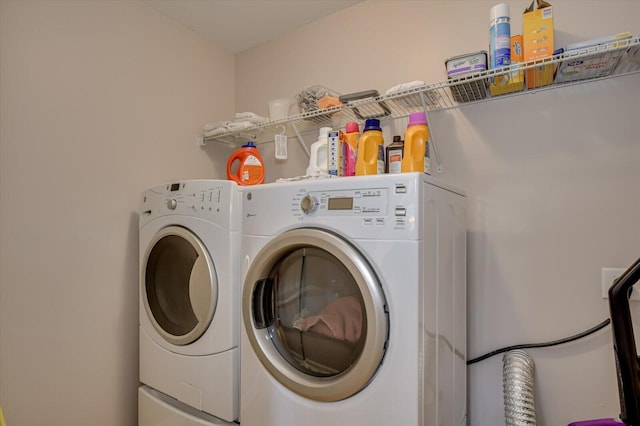 washroom featuring washing machine and dryer