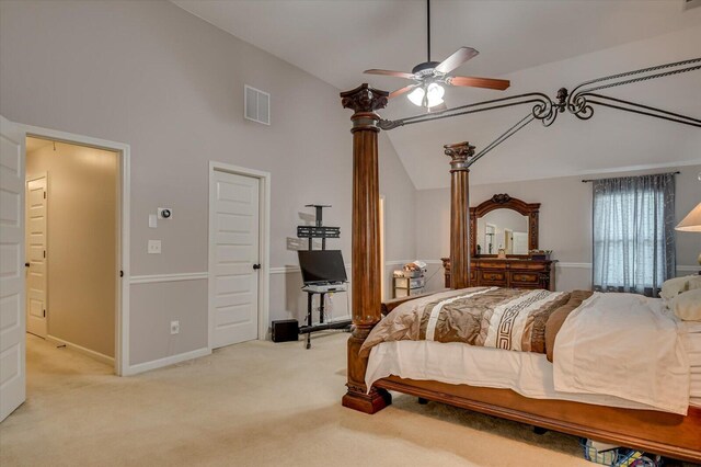 bedroom featuring ceiling fan, light carpet, and high vaulted ceiling