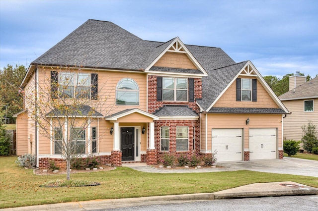 craftsman inspired home with a front lawn and a garage