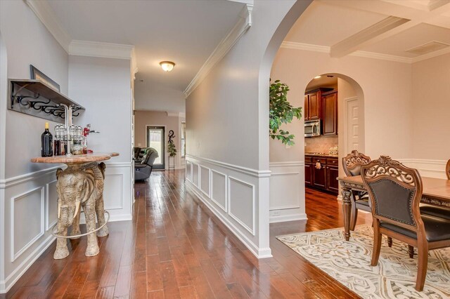 corridor featuring dark hardwood / wood-style flooring and ornamental molding