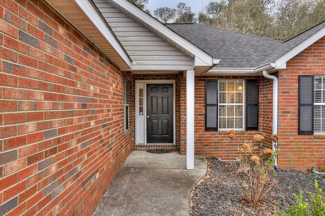 entrance to property featuring a patio