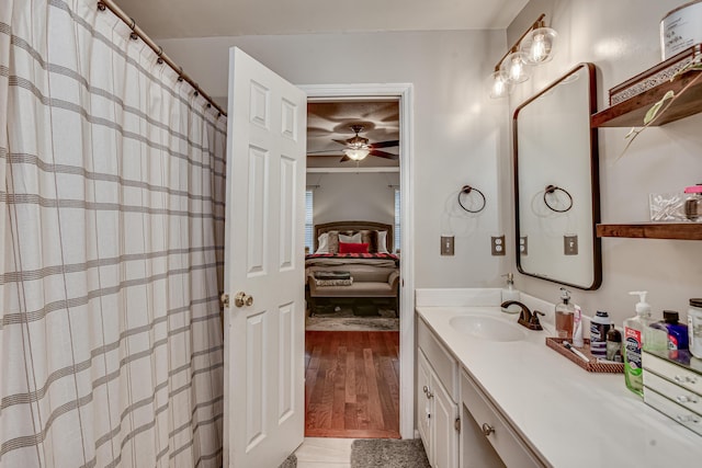 bathroom with vanity, ceiling fan, and wood-type flooring