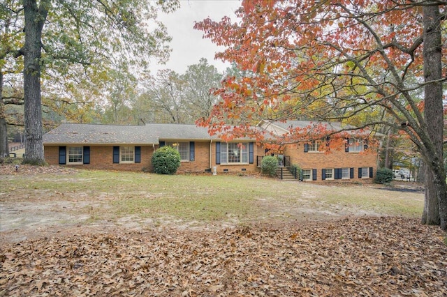 ranch-style house featuring a front yard