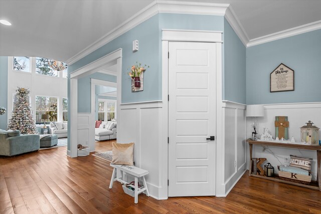 5416 Old Washington Rd, Evans, GA 30809 - hallway featuring crown molding, wood finished floors, a decorative wall, and wainscoting
