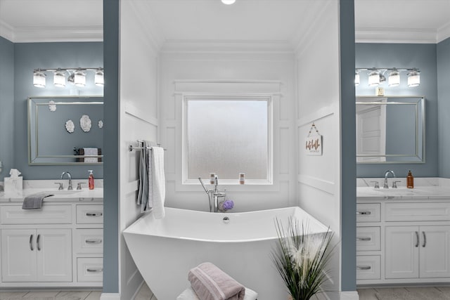 5416 Old Washington Rd, Evans, GA 30809 - bathroom featuring two vanities, crown molding, a soaking tub, and marble finish flooring