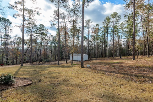 5416 Old Washington Rd, Evans, GA 30809 - view of green lawn with an outdoor structure and a view of trees