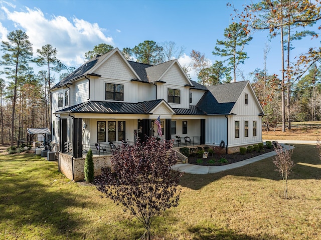 5416 Old Washington Rd, Evans, GA 30809 - modern farmhouse with a standing seam roof, covered porch, a front yard, a metal roof, and board and batten siding
