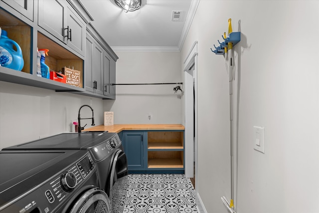 5416 Old Washington Rd, Evans, GA 30809 - laundry room featuring washer and dryer, ornamental molding, cabinet space, and light tile patterned floors