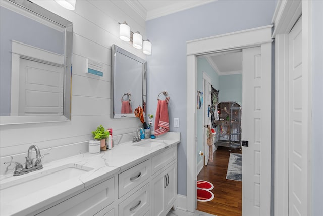 5416 Old Washington Rd, Evans, GA 30809 - bathroom featuring crown molding, double vanity, and wood finished floors