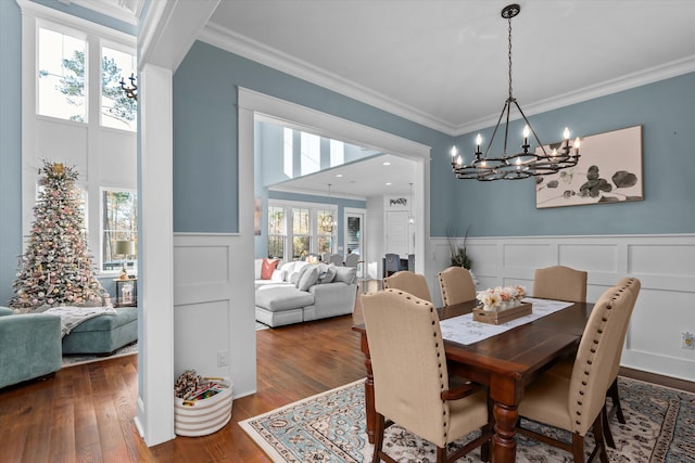 5416 Old Washington Rd, Evans, GA 30809 - dining room with a chandelier, a decorative wall, ornamental molding, wood finished floors, and wainscoting