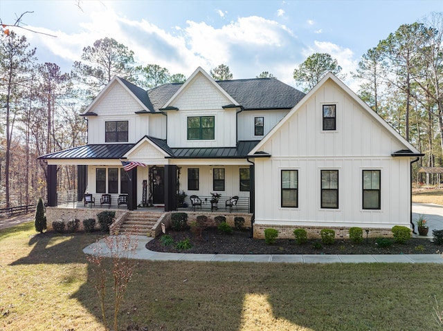 5416 Old Washington Rd, Evans, GA 30809 - modern farmhouse style home with a standing seam roof, a porch, board and batten siding, a front yard, and a shingled roof