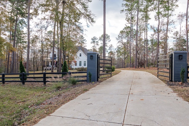 5416 Old Washington Rd, Evans, GA 30809 - view of concrete driveway with a gated entry and a gate
