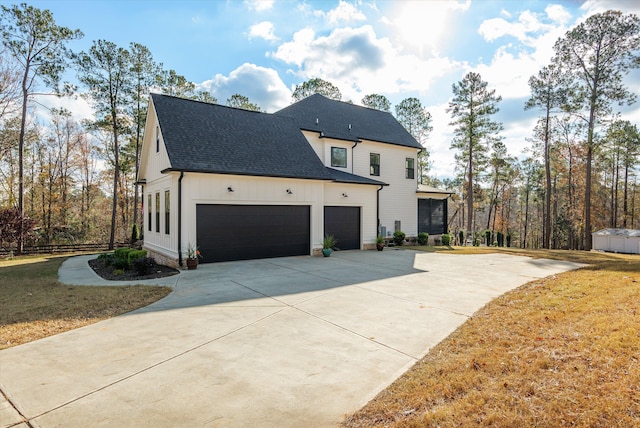 5416 Old Washington Rd, Evans, GA 30809 - view of home's exterior featuring driveway, a shingled roof, a garage, and a lawn
