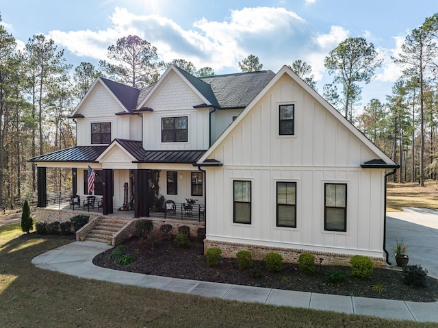 5416 Old Washington Rd, Evans, GA 30809 - modern farmhouse style home with board and batten siding, a standing seam roof, a porch, a metal roof, and roof with shingles