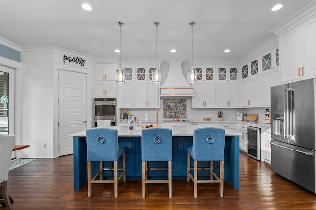 5416 Old Washington Rd, Evans, GA 30809 - kitchen with appliances with stainless steel finishes, beverage cooler, custom range hood, light countertops, and a kitchen island with sink