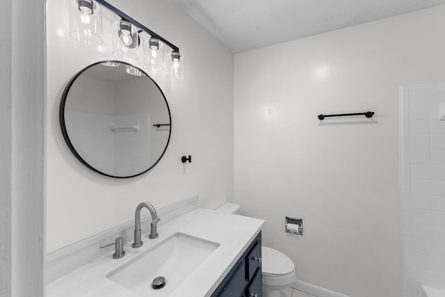 bathroom featuring tile patterned floors, vanity, and toilet