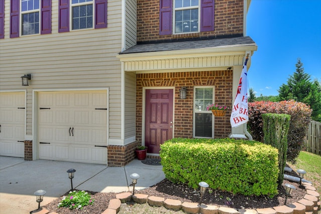 324 Congling Cir, Grovetown, GA 30813 - entrance to property with brick siding, a garage, concrete driveway, and roof with shingles