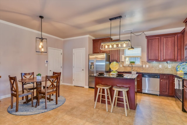 324 Congling Cir, Grovetown, GA 30813 - kitchen with appliances with stainless steel finishes, a sink, a kitchen island, ornamental molding, and tasteful backsplash
