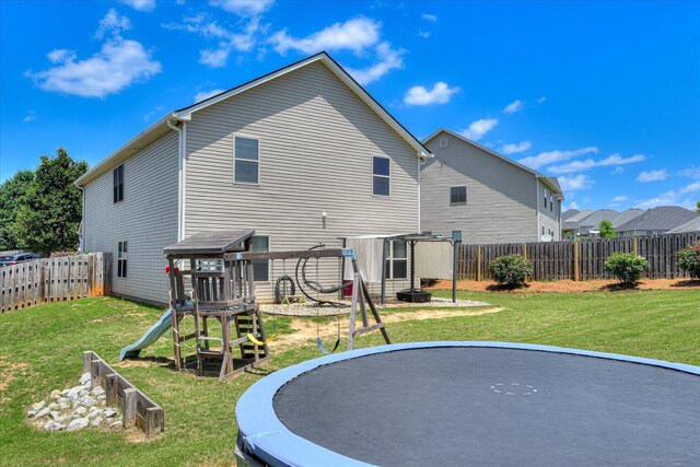 324 Congling Cir, Grovetown, GA 30813 - rear view of property featuring a playground and a trampoline
