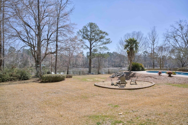 view of yard featuring an outdoor pool