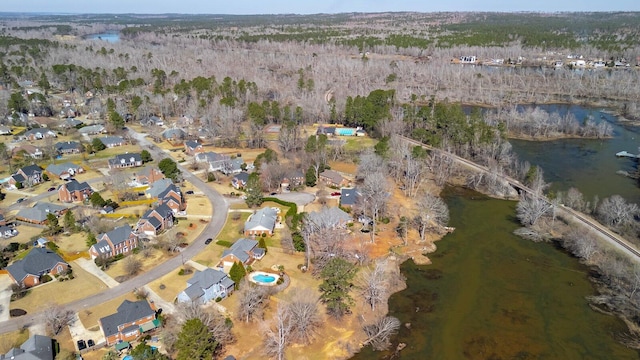 birds eye view of property with a water view and a residential view