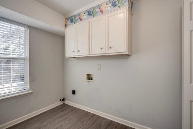 laundry area with cabinet space, baseboards, dark wood finished floors, hookup for a washing machine, and hookup for an electric dryer