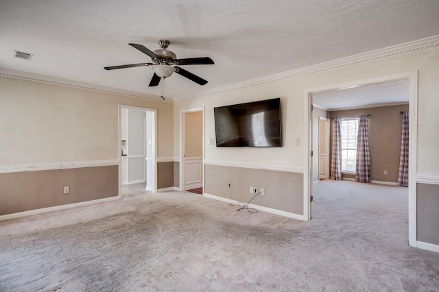 unfurnished living room with carpet, crown molding, and a textured ceiling