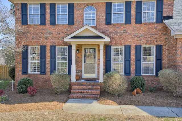 view of front of home with brick siding