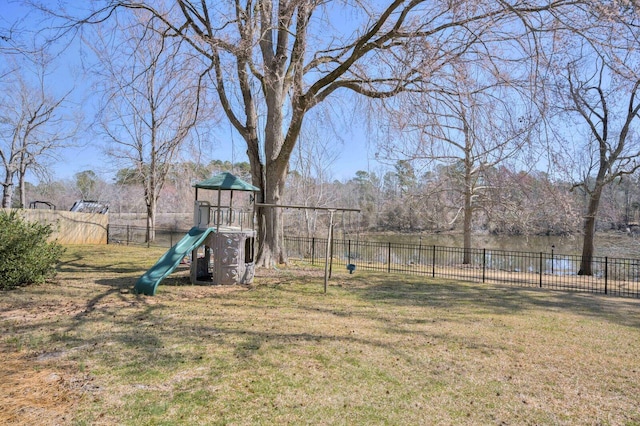 view of yard with a playground and fence