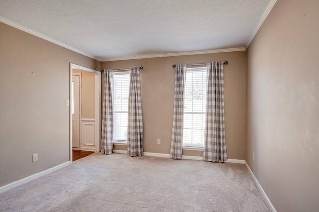 unfurnished room with a healthy amount of sunlight, carpet, and crown molding