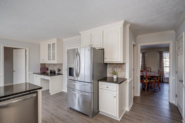 kitchen featuring stainless steel appliances, white cabinets, glass insert cabinets, and dark wood-style floors