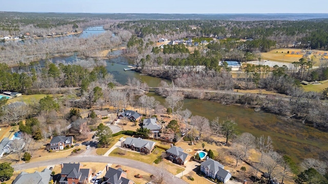 bird's eye view with a water view, a residential view, and a view of trees