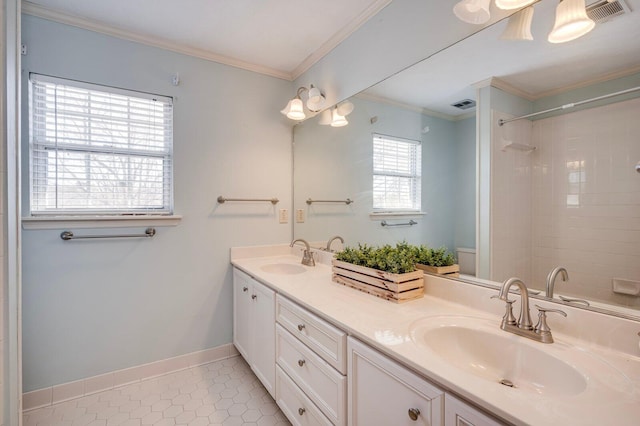 full bath featuring crown molding, visible vents, and a sink