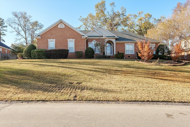 single story home with a front lawn