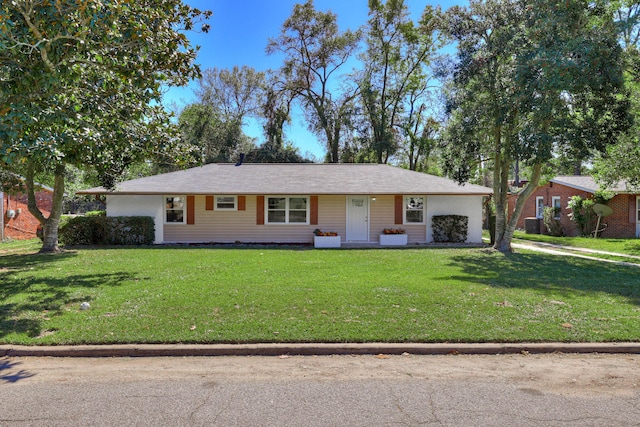 single story home featuring a front lawn