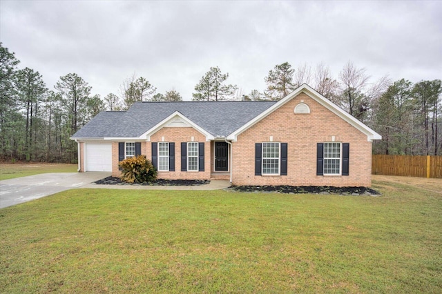 ranch-style house featuring a front yard, fence, brick siding, and driveway