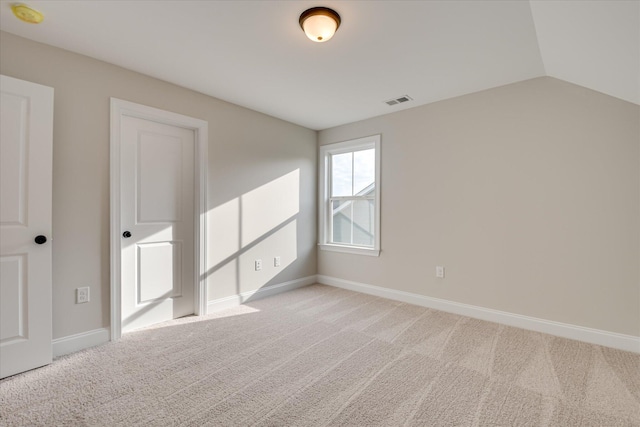 carpeted empty room with baseboards and visible vents