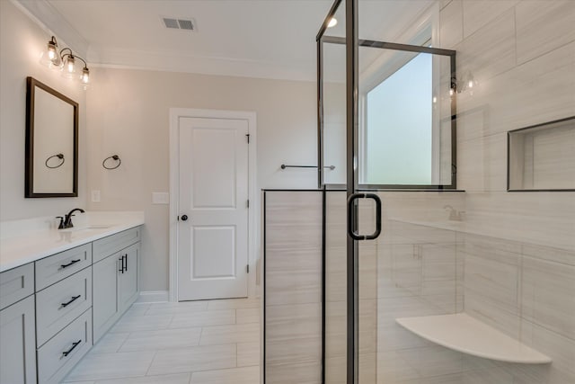 bathroom with visible vents, crown molding, vanity, baseboards, and a stall shower