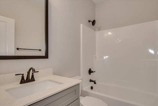 bathroom with shower / bath combination, vanity, and toilet