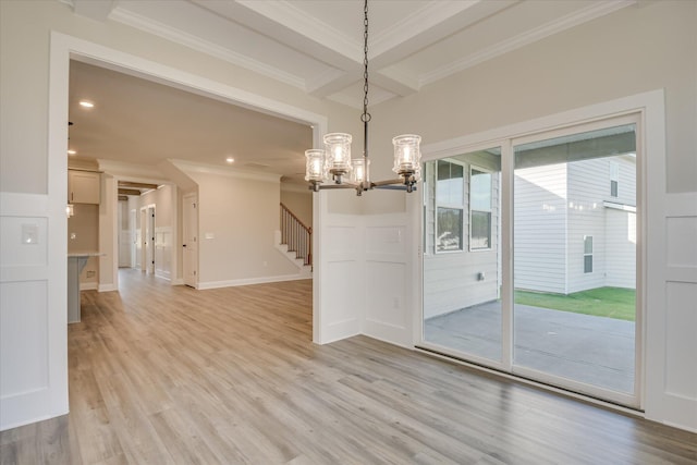 unfurnished dining area with crown molding, a notable chandelier, light wood finished floors, stairs, and recessed lighting