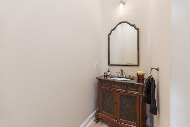 bathroom with vanity and baseboards