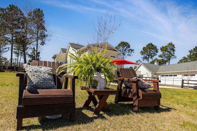 view of play area featuring a yard and fence