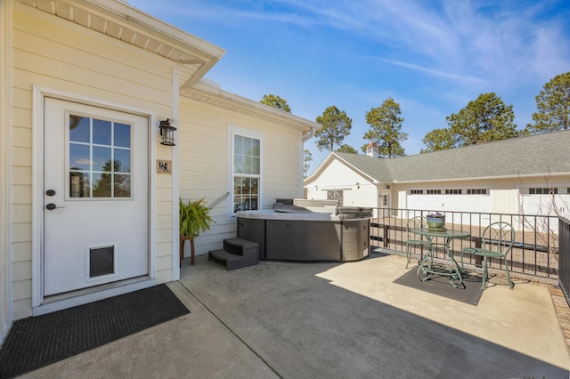 view of patio / terrace featuring a hot tub