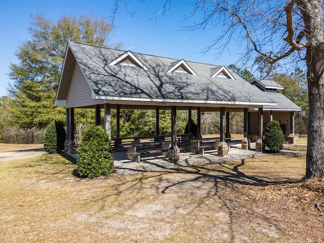 view of home's community featuring a gazebo, a lawn, and a patio area